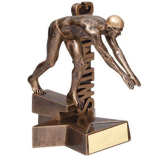 Male swimmer on diving board nest to swimming banner