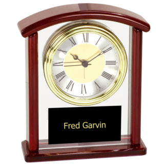 Rosewood finish and glass arch clock
